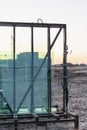 New sealed glass units at building site against the backdrop of a sunset sky. Storage and preparation at the installation of