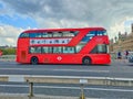 New shape Red London Routemaster bus on Westminster bridge Royalty Free Stock Photo