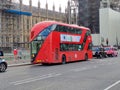 New shape Red London Routemaster bus on Westminster bridge