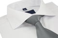 New shirt with a grey striped necktie on a white Royalty Free Stock Photo