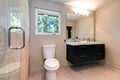 New simple modern bathroom with double sinks and natural ceramic tile.