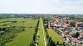 New Skyline of Milan seen from the Milanese hinterland, aerial view, tree lined avenue. Pedestrian cycle path Royalty Free Stock Photo