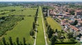 New Skyline of Milan seen from the Milanese hinterland, aerial view, tree lined avenue. Pedestrian cycle path Royalty Free Stock Photo