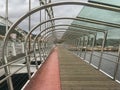 The new sleek modern steel bridge at Pontevedra looking down the pedestrian walkway