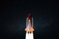 New space shuttle rocket with blast successfully takes off into the night starry sky. Spaceship launched into outer deep space Royalty Free Stock Photo