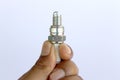 New spark plug in hand before use Royalty Free Stock Photo