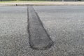 New speed bump on asphalt road Royalty Free Stock Photo