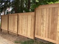 New staggered cedar fencing on slope Royalty Free Stock Photo