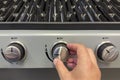 The new stainless steel barbecue is used for the first time. Turning on the new grill. The hand turns on the silver
