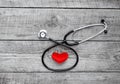 New stethoscope with plush heart on wooden table isolated Royalty Free Stock Photo