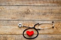 New stethoscope with plush heart on wooden table isolated Royalty Free Stock Photo