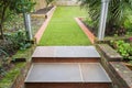 New stone steps and turf laid during a winter garden landscaping project. Along with new brick edging and a new bed Royalty Free Stock Photo