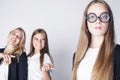 New student bookwarm in glasses against casual group on white background, teen drama, lifestyle people concept Royalty Free Stock Photo