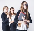 New student bookwarm in glasses against casual group on white background, teen drama, lifestyle people concept Royalty Free Stock Photo