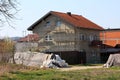 New suburban family house under construction surrounded with building scaffolding and other houses next to temporary flood Royalty Free Stock Photo