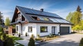 New suburban house with a photovoltaic system on the roof. Modern eco friendly passive house with solar panels on the gable roof, Royalty Free Stock Photo