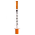 New syringe with orange cap isolated on white. Injection