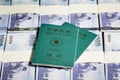 New Taiwan Dollars in stacks with ROC passport Royalty Free Stock Photo