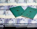 New Taiwan Dollars in stacks with ROC passport Royalty Free Stock Photo