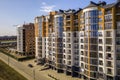 New tall apartment buildings and parked cars and suburb houses on blue sky copy space background Royalty Free Stock Photo