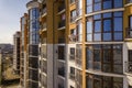 New tall apartment buildings and parked cars and suburb houses on blue sky copy space background Royalty Free Stock Photo