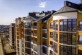 New tall apartment buildings and parked cars and suburb houses on blue sky copy space background Royalty Free Stock Photo