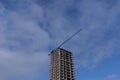 Building construction site with tower crane against blue sky Royalty Free Stock Photo