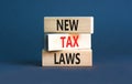 New tax laws symbol. Concept words New tax laws on wooden blocks on a beautiful grey table grey background. Business new tax laws Royalty Free Stock Photo