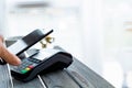 Contactless payment wih mobile phone and terminal. Royalty Free Stock Photo