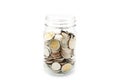 New Thai Baht coins in a glass jar. Royalty Free Stock Photo