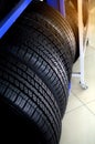 New tires that is stored on the shelf. Car workshop, car repair Royalty Free Stock Photo