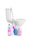 New toilet bowl and bottles of detergent on white background Royalty Free Stock Photo