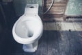 New toilet in derelict bathroom Royalty Free Stock Photo