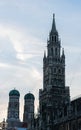 New Town Hall tower and Frauenkirche in background at sunset. Low angle Royalty Free Stock Photo