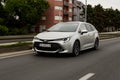 New Toyota Corolla, 2019 model in urban environment. Car in motion. Front view of the car. Royalty Free Stock Photo