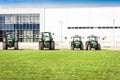 New tractors are standing next to the trading pavilion for sale in Kiev region, Ukraine