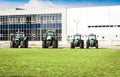 New tractors are standing next to the trading pavilion for sale in Kiev region, Ukraine