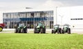 New tractors are standing next to the trading pavilion for sale in Kiev region, Ukraine