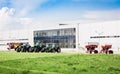 New tractors are standing next to the trading pavilion for sale in Kiev region, Ukraine