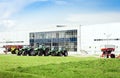 New tractors are standing next to the trading pavilion for sale in Kiev region, Ukraine