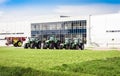 New tractors are standing next to the trading pavilion for sale in Kiev region, Ukraine