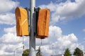 New traffic lights covered with orange plastic bags