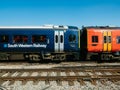 New train wagons - red and blue of South Western Railway transportaiton company Royalty Free Stock Photo