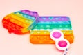 New trend sensory rainbow silicone anti-stress toy for the development of fine motor skills in children. Colorful toy simple