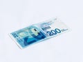 A new type of banknote worth 200 Israeli shekels isolated on a white background