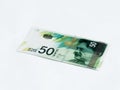 A new type of banknote worth 50 Israeli shekels isolated on a white background