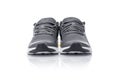 Unbranded black sport running shoes or sneakers isolated on white background.