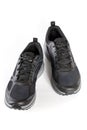New unbranded running sneaker or trainer isolated on white background. Men`s black sport footwear. Close-up of a pair sneakers or Royalty Free Stock Photo