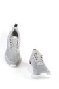 New unbranded running sneaker or trainer isolated on white background. Men`s light grai sport footwear. Close-up of a pair Royalty Free Stock Photo