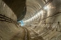 New, under construction, empty concrete round deep subway tunnel made of concrete blocks Royalty Free Stock Photo